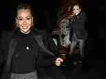 Olivia Attwood puts on a leggy display in tweed shorts and a black blazer as she enjoys festive night out with her friends